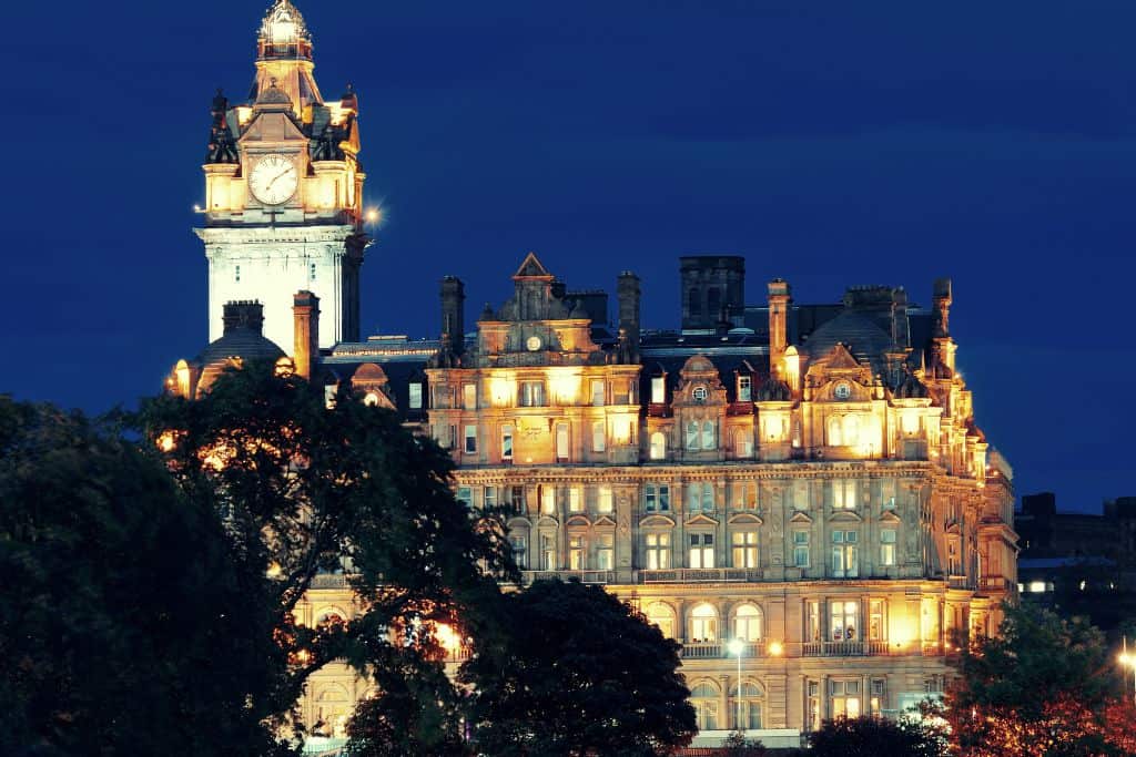 A view of the Balmoral Hotel at night, one of the best places to stay in Edinburgh's New Town.