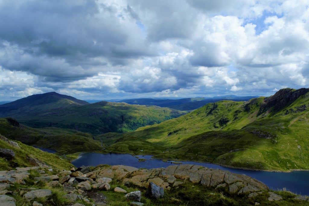 A birds-eye view of Snowdonia National Park, a must-see during 3 days in Wales, which includes mountains, valleys, and rivers.