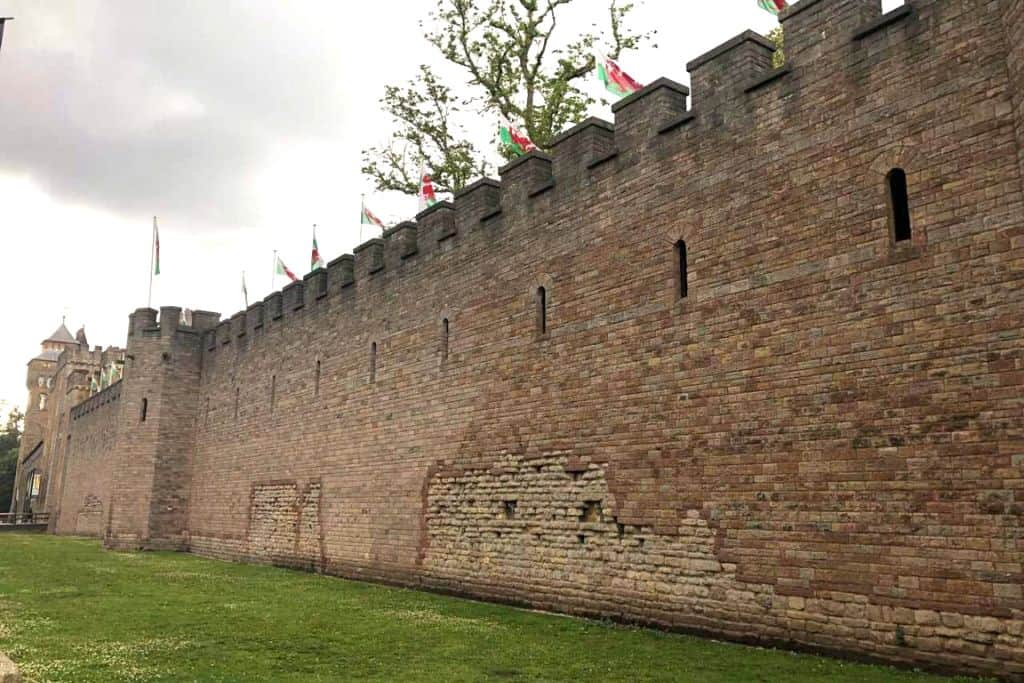 One of the outside walls at Castle Cardiff that shows flags waving in the Wales wind.