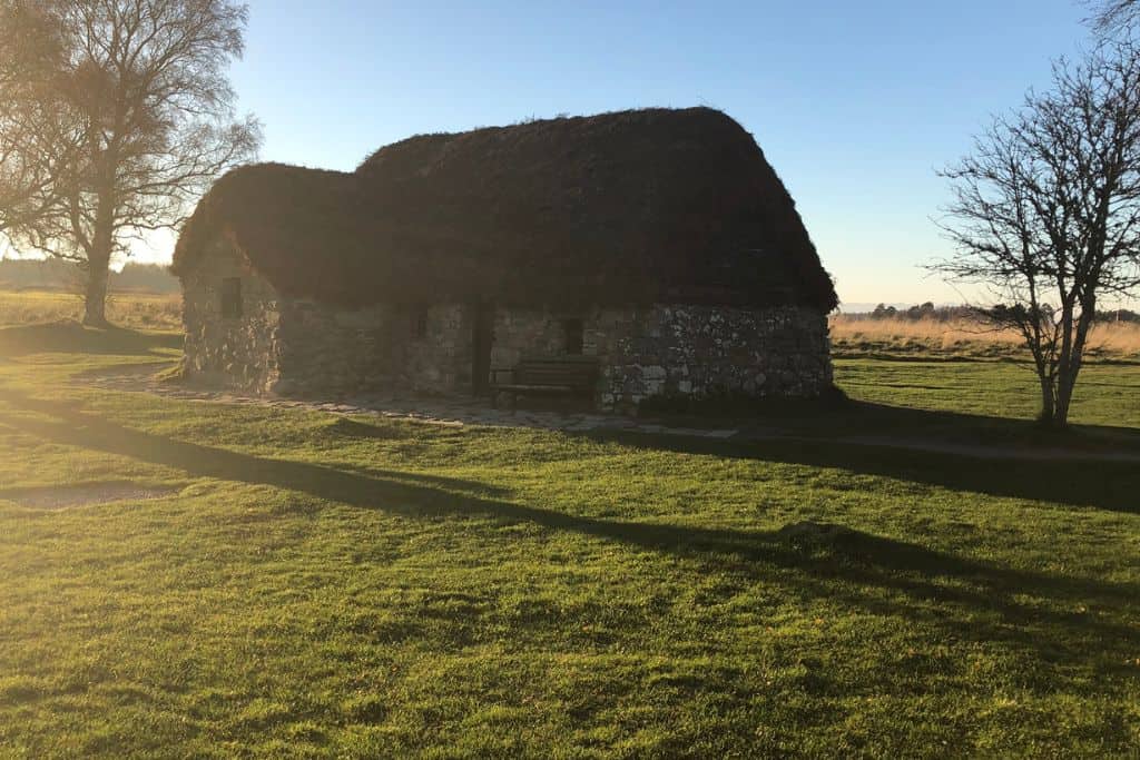 Country home with a thatched roof in the highlands.