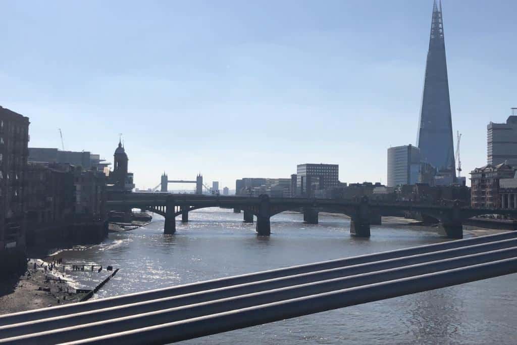 What is London Famous For A view of London Bridge over the River Thames. The Tower bridge can be seen in the background with the Shard. These are some of the most well known monuments which make up London's skyline.