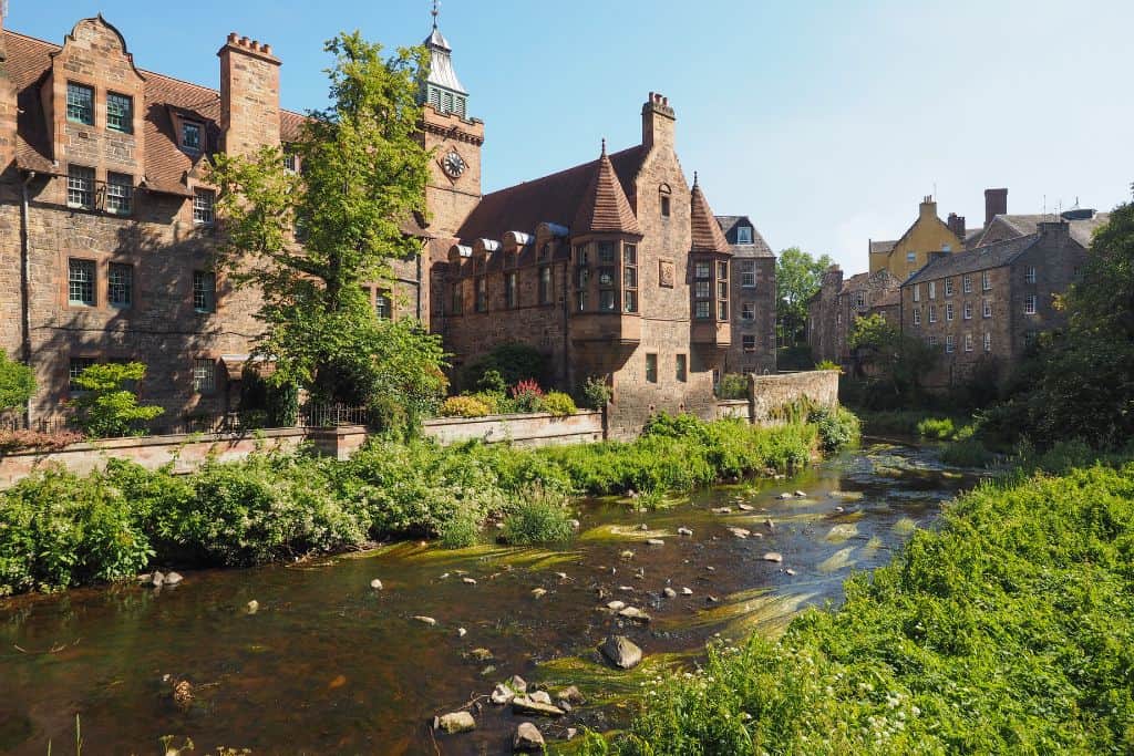 Famous-Streets-in-Edinburgh Dean Village, a charming part of the city with old stone buildings along the scenic waterway. It is one of the best places to visit in Edinburgh.