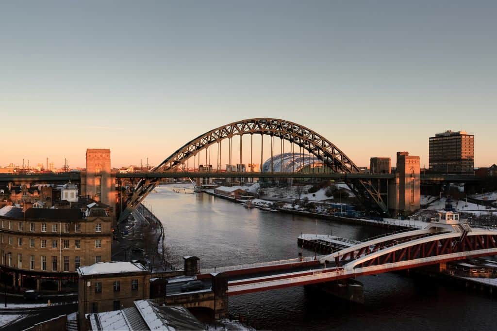 Day Trips From Edinburgh Without a Car The skyline over the river and bridge at Newcastle-upon-Tyre at sunrise.